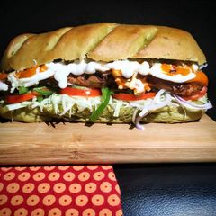 A picture of Healthy Sub Sandwich (Multigrain spinach loaf and Rajma Tikki).