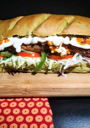 A picture of Healthy Sub Sandwich (Multigrain spinach loaf and Rajma Tikki).