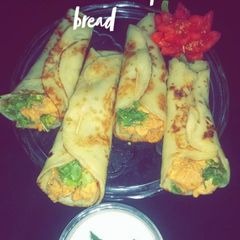 A picture of Chicken shawarma roll with homemade peta bread.