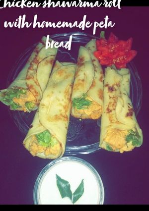 A picture of Chicken shawarma roll with homemade peta bread.