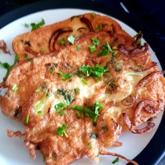 A picture of Egg'y bread with coriander and onion.