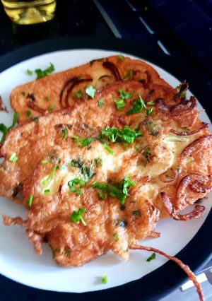 A picture of Egg'y bread with coriander and onion.