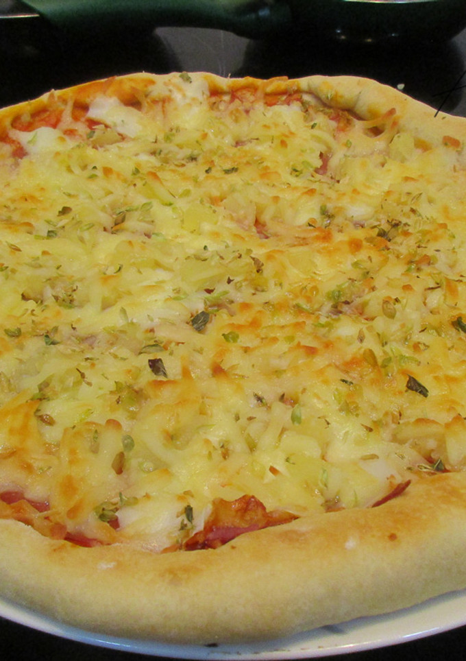 Una foto de Pizza de Jamón y queso (con piña)