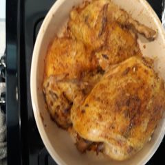 A picture of Dutch Oven Roasted Chicken with wild rice.