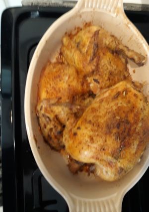 A picture of Dutch Oven Roasted Chicken with wild rice.