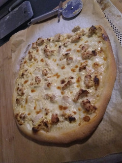 Une photo de Pizza curry dinde