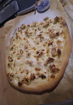 Une photo de Pizza curry dinde