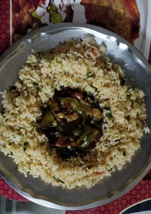 A picture of Chilli Paneer with Fried Rice.
