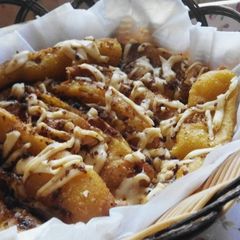 A picture of Fried Banana - with grated cheese and palm sugar on top.
