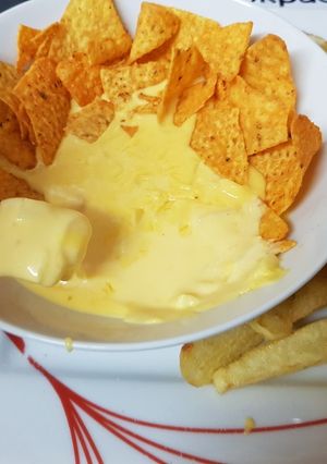 A picture of Made Chedder cheese & Onion sauce with tortillas for dipping. 👍.