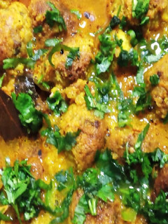 A picture of Kacha Kolar Kofta curry/ Plantain Kofta Curry.
