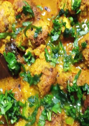 A picture of Kacha Kolar Kofta curry/ Plantain Kofta Curry.