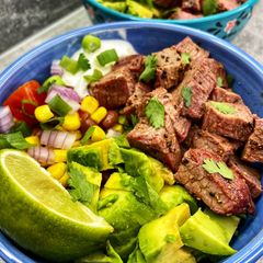 A picture of Chicken/Steak burrito bowls (Chipotle bowls).