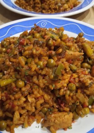 A picture of Paella Rice with Chicken and Vegetables.