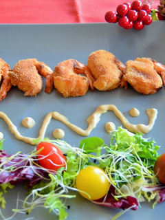 Una foto de Gambas con bechamel