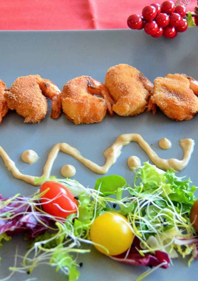Una foto de Gambas con bechamel