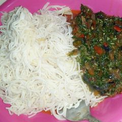 A picture of Spaghetti and vegetable sauce.