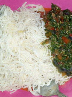 A picture of Spaghetti and vegetable sauce.