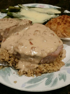 A picture of Brad's tuna steaks over couscous with pan sauce.
