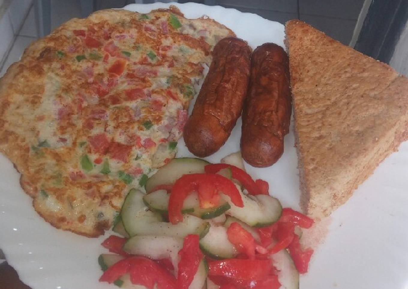 Simple breakfast... omelette,sausages,salad,bread