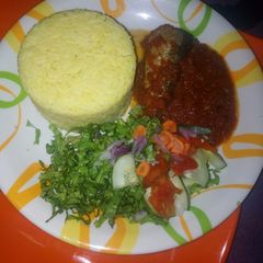 A picture of Curry rice with stew and latus.