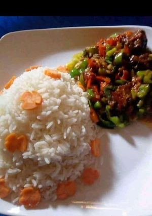 A picture of Rice with vegetable sauce.