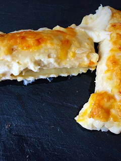 Una foto de Canelones con salchichas y verduras