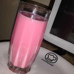 A picture of Milk with rooh afza.