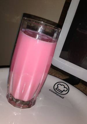 A picture of Milk with rooh afza.