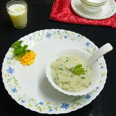 A picture of Rice with potato and spinach.