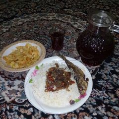 White rice &onion sauce with zobo A picture of White rice &onion sauce with zobo.