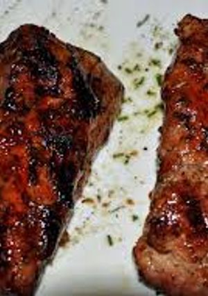A picture of Grilled Pork Tenderloin with Pomegranate and Orange Glaze.