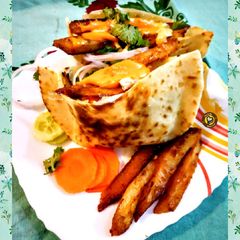 A picture of Chicken Shawarma In Pita Bread.