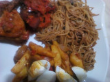 Brown spaghetti with sauteed potatoes and peppered chicken