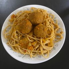 A picture of Spaghetti with veg balls.