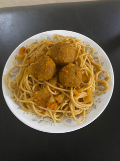 A picture of Spaghetti with veg balls.