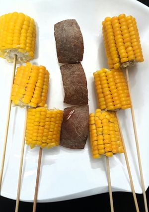 A picture of Yellow corn with coconut.