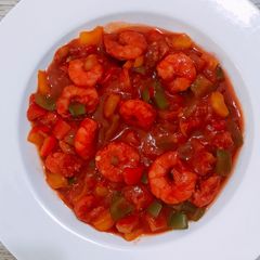 A picture of Shrimp and veggy sauce.