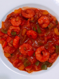 A picture of Shrimp and veggy sauce.