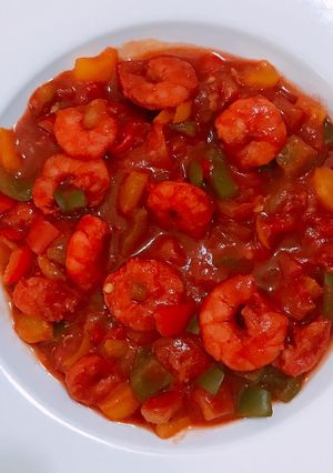 A picture of Shrimp and veggy sauce.