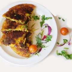 A picture of A Healthy veggie rich Uthappam.