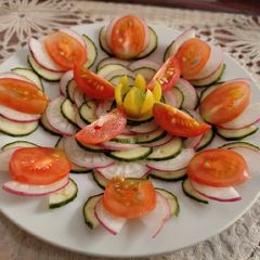 A picture of Cucumber, Radish and cherry tomatoes Salad.
