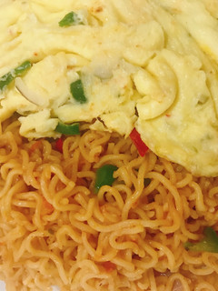 A picture of Noodle and fried egg.