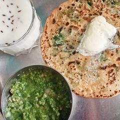 A picture of Spinach Paratha with Mint chutney & Buttermilk.