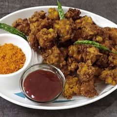 A picture of Sweet corn 🌽fritters / bhajiya/Pakoda.