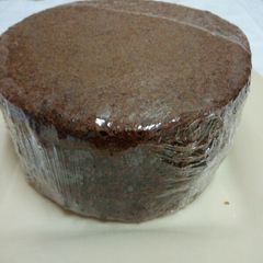 A picture of Chocolate cake with ground nuts.