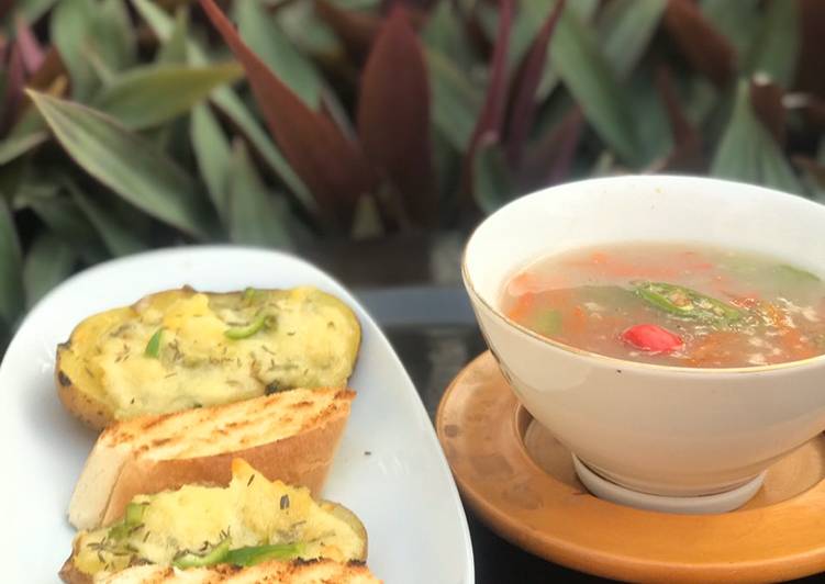 Thai vegetables soup with baked cheesy potatoes