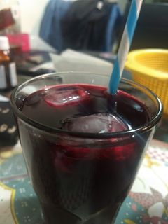 Una foto de Agua Fresca de Engañó pseudo cereza (Naranja y Betabel)