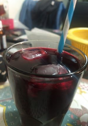 Una foto de Agua Fresca de Engañó pseudo cereza (Naranja y Betabel)