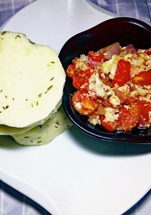 A picture of White yam flavored with Thyme and Egg Sauce.